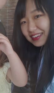 Choir member Jina smiling